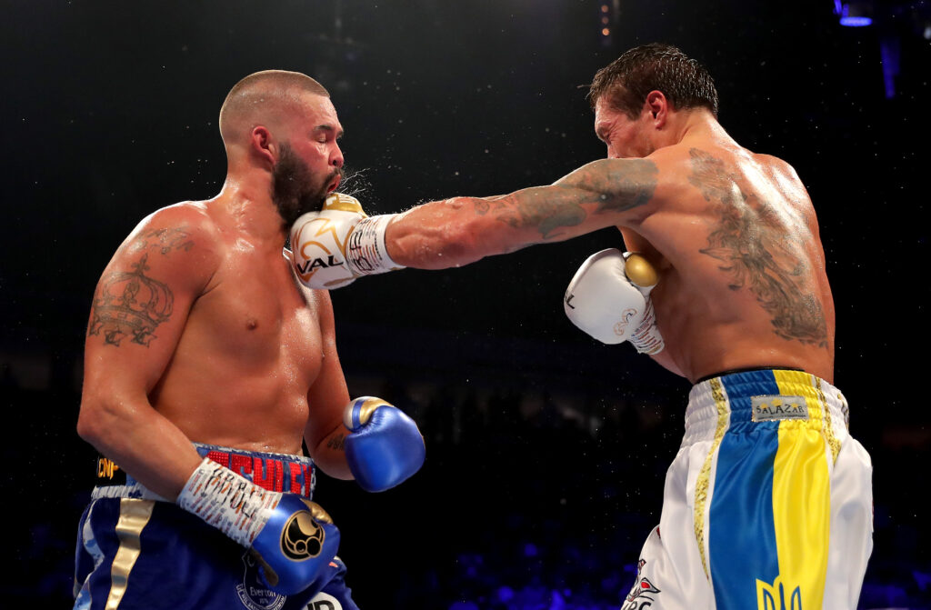 Oleksandr Usyk hits a strong left hand into the face of Tony Bellew as sweat and spit spray everywhere
