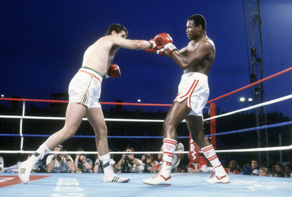 Larry Holmes fights Gerry Cooney in a WBC heavyweight title bout in Las Vegas in 1982