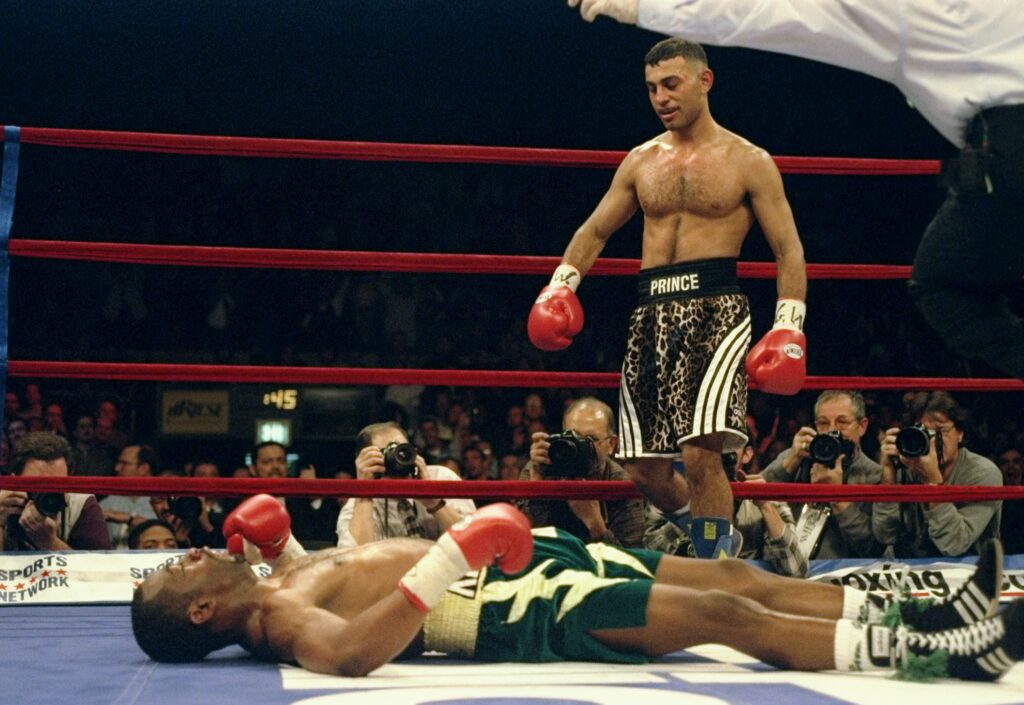 Naseem Hamed stands over Kevin Kelley during their featherweight title fight at Madison Square Garden