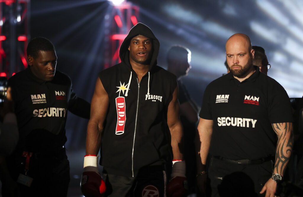 Daniel Dubois makes his entrance flanked by security at the Manchester Arena in 2017