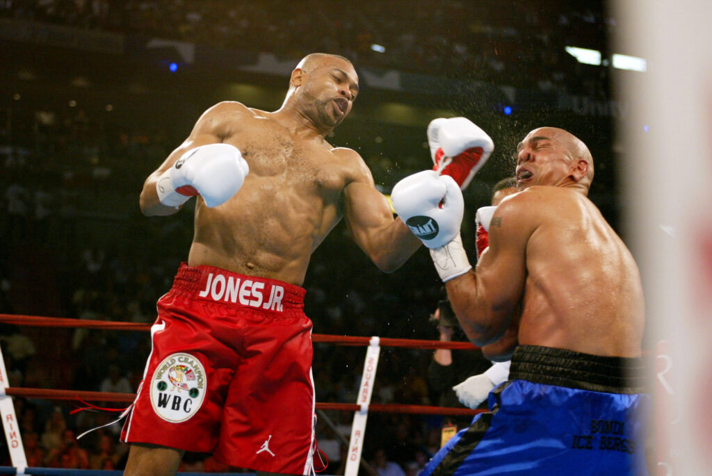 Roy Jones Jr. punches Glen Kelly with a left hook during their light heayweight title fight in 2002